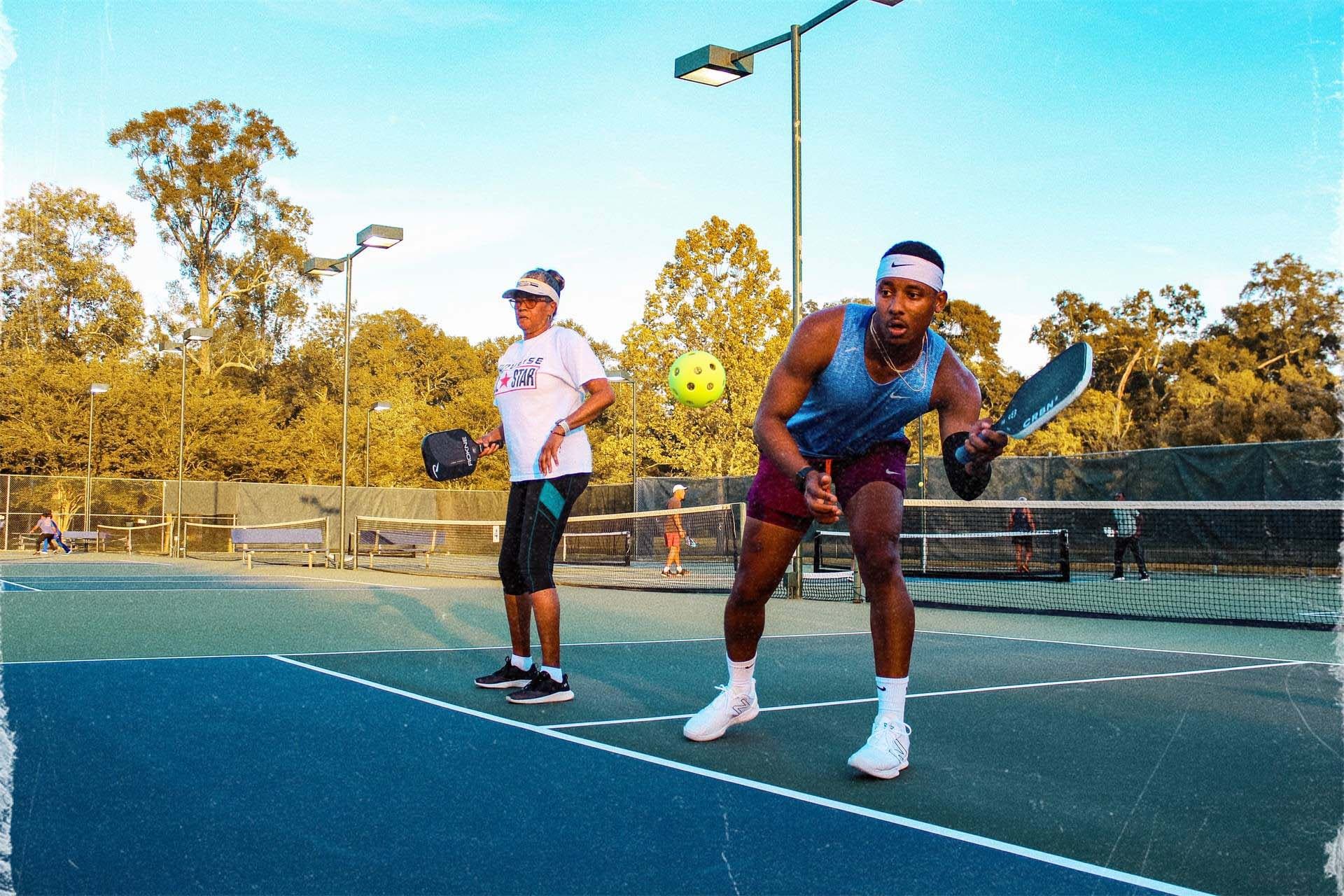 Pickleball players on an outdoor court